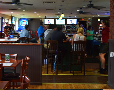 Crowded Bar with Live Musician